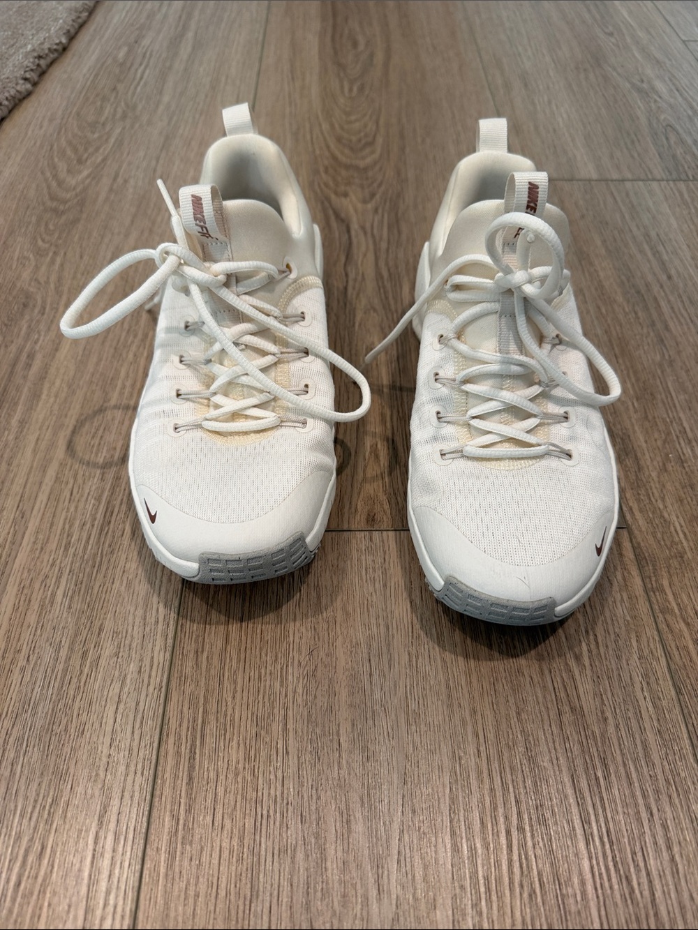 Nike Women's White Athletic Sneakers with Small Maroon Swoosh